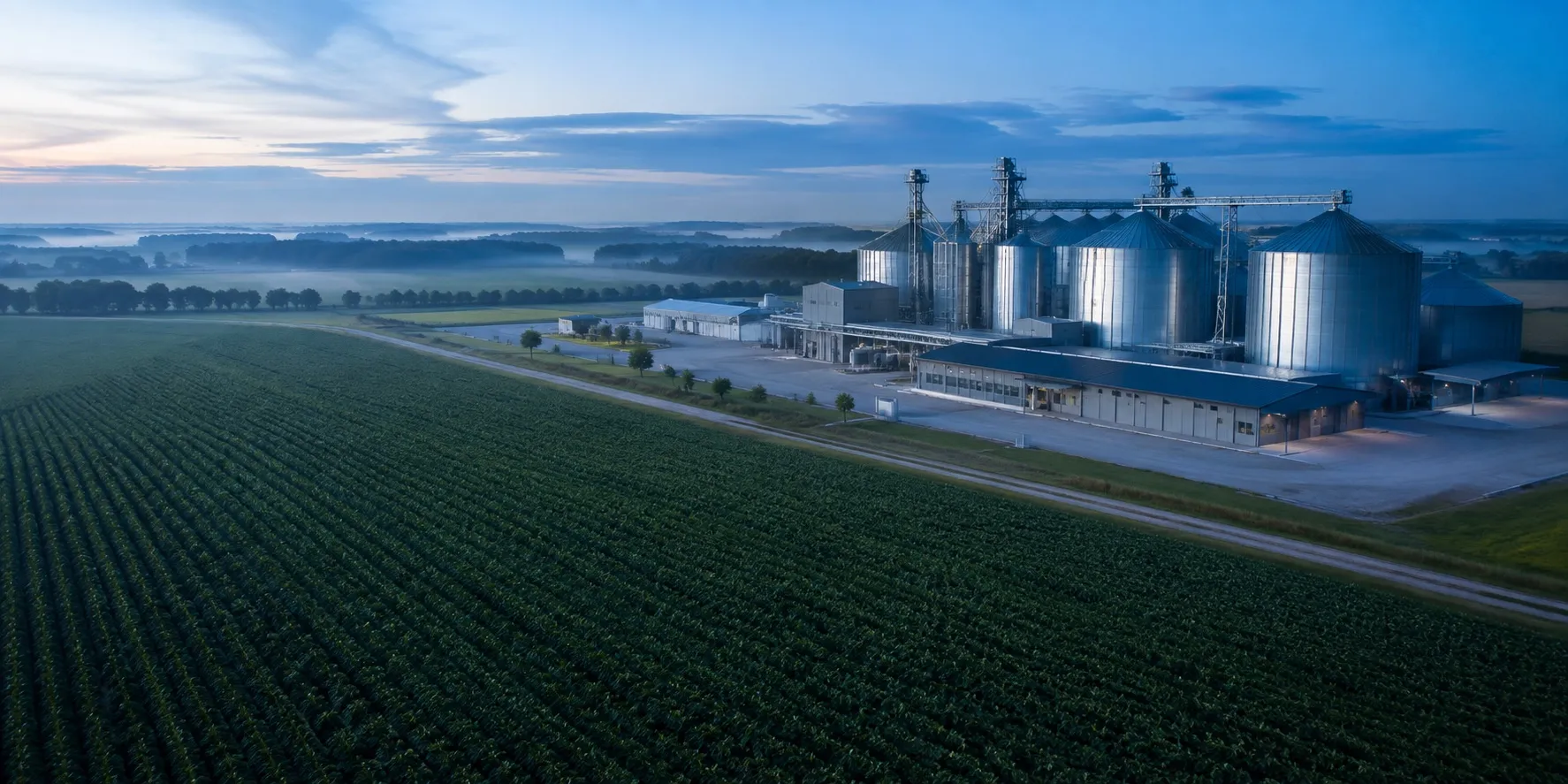 Conceptual aerial view of seed fields and a seed-processing facility